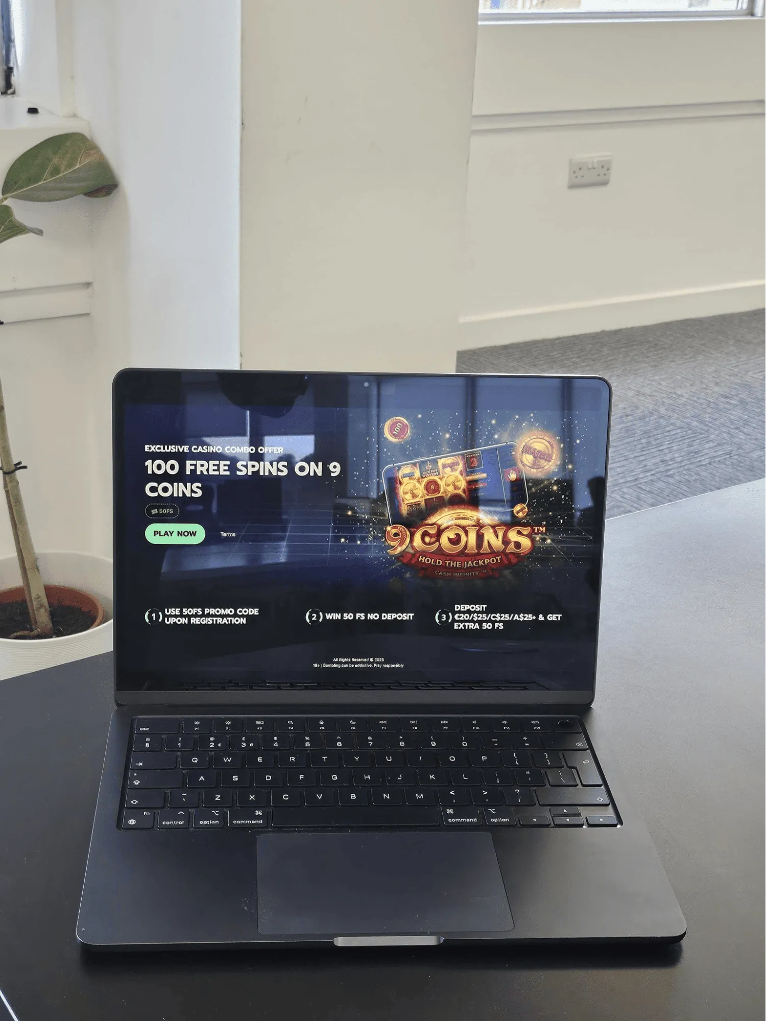 Open laptop on a table showing Betrix no deposit bonus.